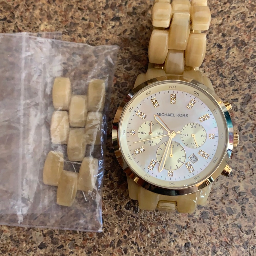 Beautiful gold Michael Kors gold face watch with extra links